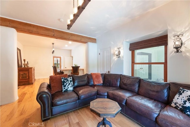 1615 Halsey St, Redlands, CA 92373 - living room featuring light wood-type flooring and beamed ceiling