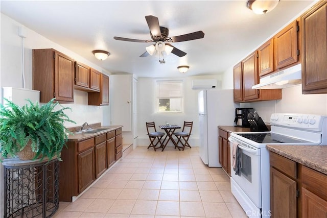 1615 Halsey St, Redlands, CA 92373 - kitchen featuring white appliances, under cabinet range hood, light tile patterned flooring, a ceiling fan, and brown cabinetry