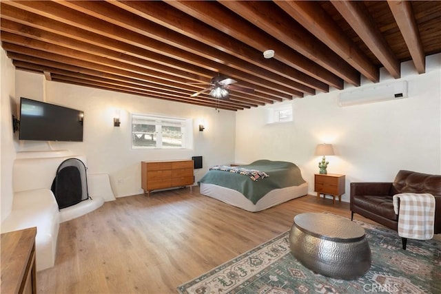 1615 Halsey St, Redlands, CA 92373 - bedroom featuring wood finished floors, beam ceiling, and a fireplace with raised hearth