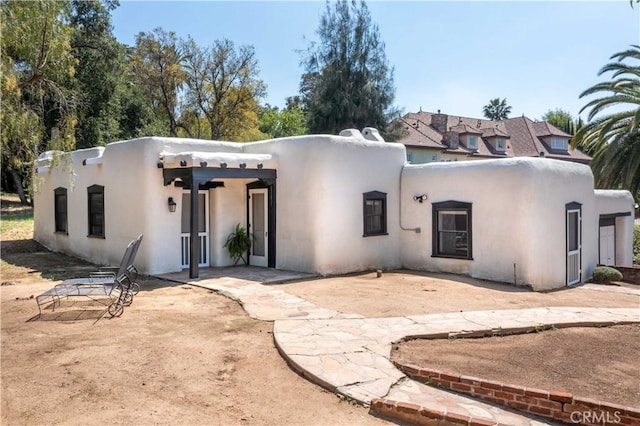 1615 Halsey St, Redlands, CA 92373 - view of front facade with a patio area and stucco siding