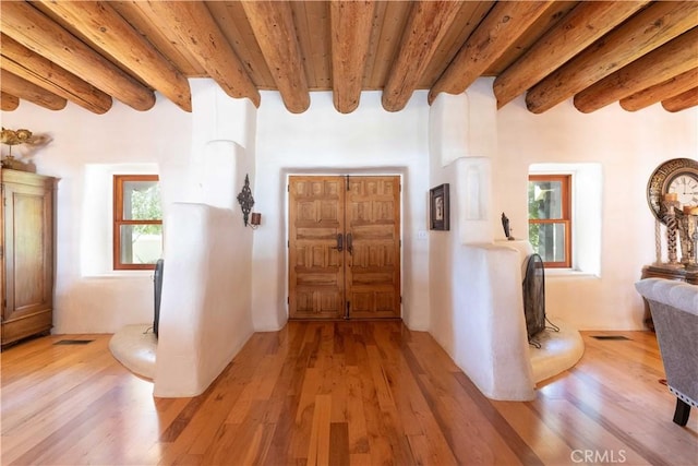 1615 Halsey St, Redlands, CA 92373 - foyer entrance with light wood-style flooring and a wooden ceiling with exposed beams