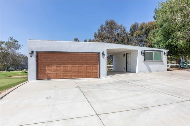 1615 Halsey St, Redlands, CA 92373 - view of front facade with stucco siding and a garage