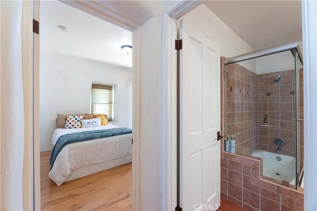 1615 Halsey St, Redlands, CA 92373 - full bath with connected bathroom, tiled shower / bath combo, and wood finished floors