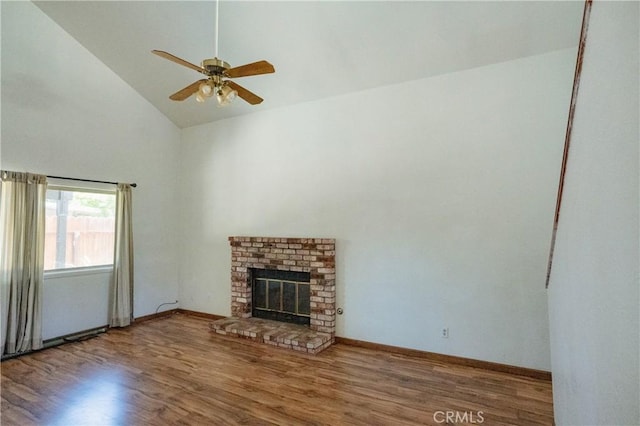 3117 Andre Ln, Turlock, CA 95382 - unfurnished living room featuring wood finished floors, a fireplace, ceiling fan, and high vaulted ceiling