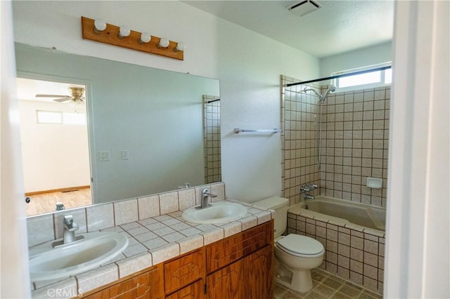 3117 Andre Ln, Turlock, CA 95382 - bathroom with double vanity, tiled shower / bath combo, and a ceiling fan