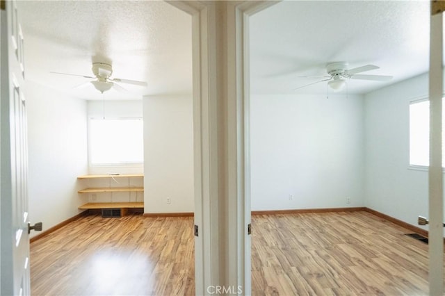 3117 Andre Ln, Turlock, CA 95382 - empty room with ceiling fan, healthy amount of natural light, and wood finished floors