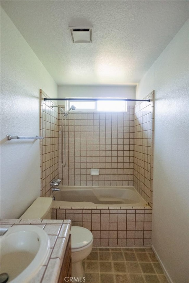 3117 Andre Ln, Turlock, CA 95382 - full bath featuring vanity, shower / bath combination, a textured ceiling, and tile patterned flooring