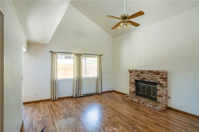 3117 Andre Ln, Turlock, CA 95382 - unfurnished living room featuring wood finished floors, a fireplace, a ceiling fan, and high vaulted ceiling