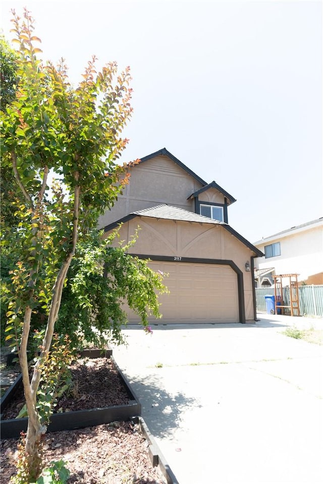 3117 Andre Ln, Turlock, CA 95382 - view of front of property featuring stucco siding, driveway, and an attached garage
