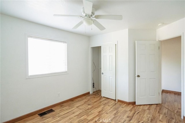 3117 Andre Ln, Turlock, CA 95382 - unfurnished bedroom with light wood-style flooring, a closet, and a ceiling fan