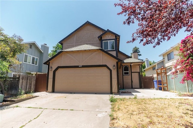 3117 Andre Ln, Turlock, CA 95382 - view of front of home featuring stucco siding, driveway, and an attached garage