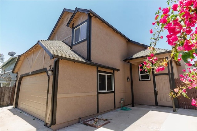 3117 Andre Ln, Turlock, CA 95382 - back of house with stucco siding and an attached garage