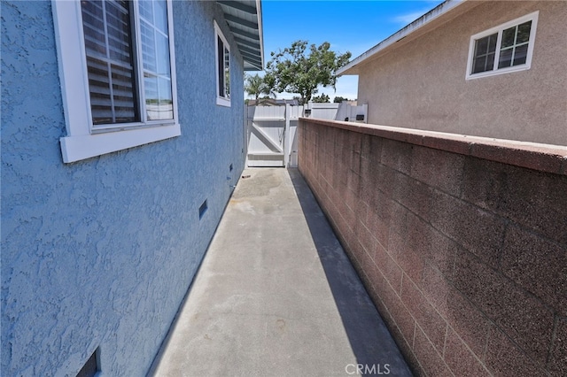 15403 Domart Ave, Norwalk, CA 90650 - view of side of property with stucco siding and crawl space