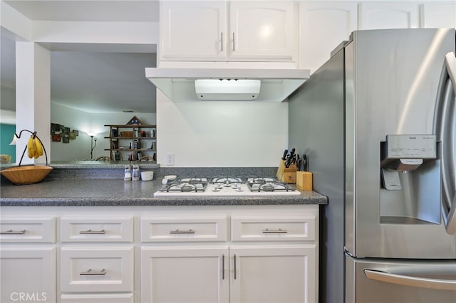 15403 Domart Ave, Norwalk, CA 90650 - kitchen featuring stainless steel fridge with ice dispenser, white gas stovetop, white cabinetry, and dark countertops