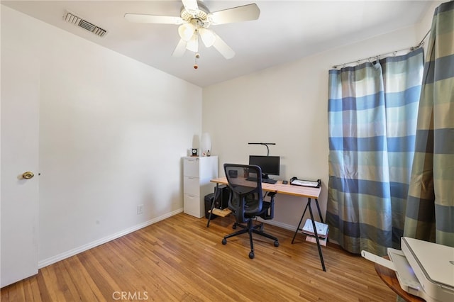 15403 Domart Ave, Norwalk, CA 90650 - office area featuring wood finished floors, a ceiling fan, and baseboards