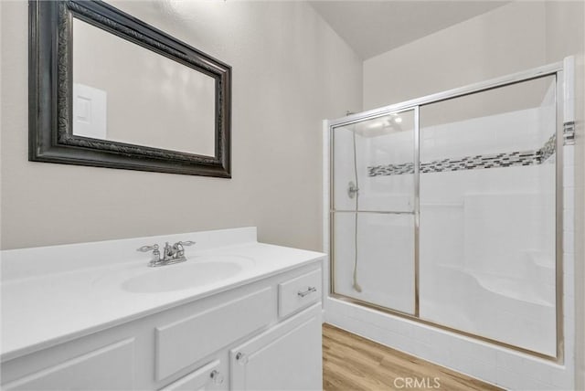 46186 Via Ln, Tranquila, Temecula, CA 92592 - full bathroom featuring a shower stall, vanity, and wood finished floors