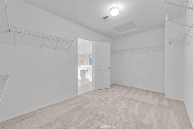 46186 Via Ln, Tranquila, Temecula, CA 92592 - walk in closet featuring attic access and carpet floors