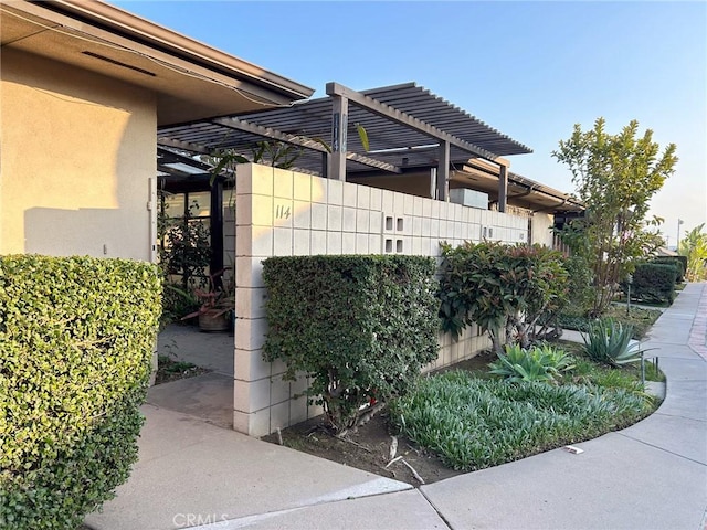 999 E Valley Blvd Unit 114, Alhambra, CA 91801 - view of side of home with a pergola and stucco siding
