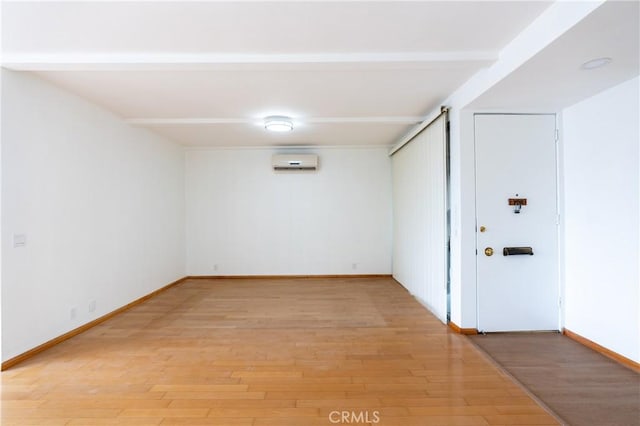 999 E Valley Blvd Unit 114, Alhambra, CA 91801 - unfurnished room with a wall mounted AC and light wood-type flooring