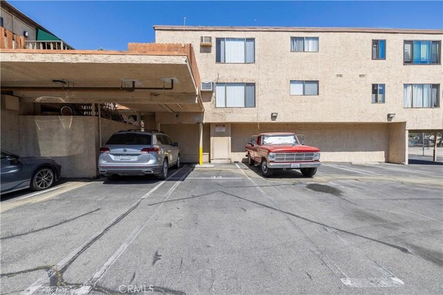 17900 Sherman Way Unit 416, Reseda, CA 91335 - view of property featuring a parking lot