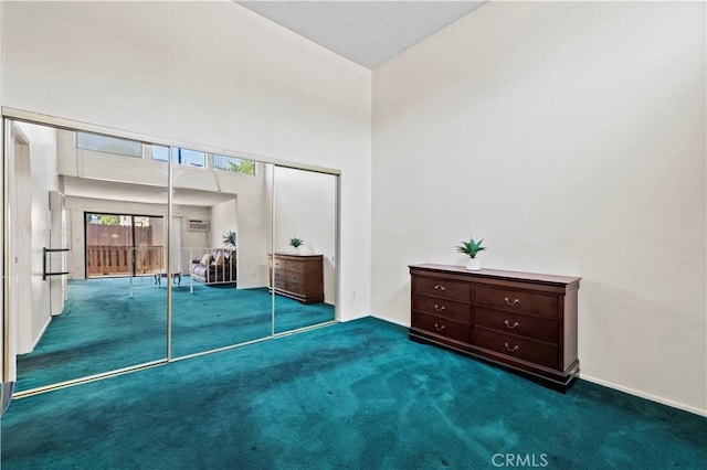17900 Sherman Way Unit 416, Reseda, CA 91335 - carpeted bedroom with a towering ceiling, a closet, and baseboards