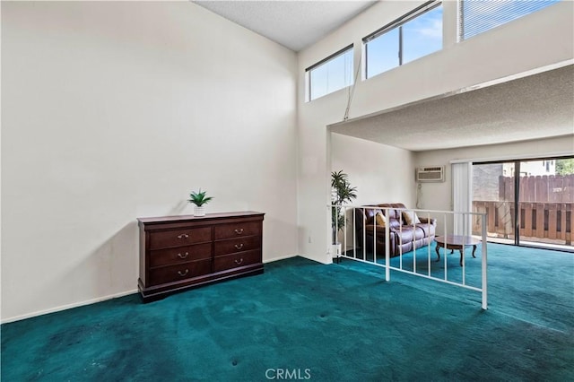 17900 Sherman Way Unit 416, Reseda, CA 91335 - sitting room with plenty of natural light, carpet flooring, an AC wall unit, a high ceiling, and a textured ceiling