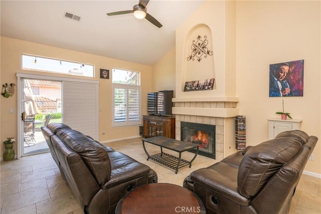 31436 Corte Sonora, Temecula, CA 92592 - living room with a ceiling fan, a fireplace, high vaulted ceiling, and stone tile flooring