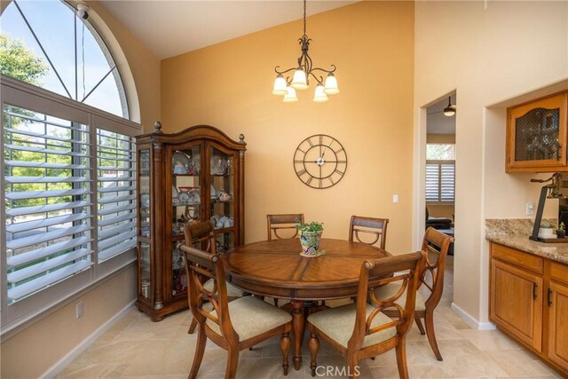 31436 Corte Sonora, Temecula, CA 92592 - dining room featuring a chandelier, a towering ceiling, and light tile patterned flooring