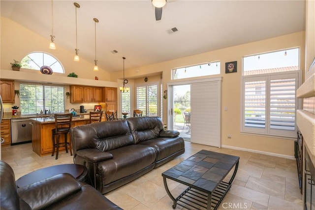 31436 Corte Sonora, Temecula, CA 92592 - living room featuring stone tile floors, plenty of natural light, and high vaulted ceiling