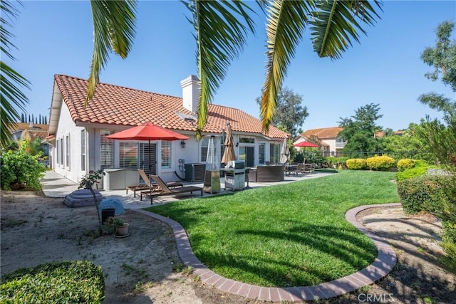 31436 Corte Sonora, Temecula, CA 92592 - rear view of property featuring a tile roof, stucco siding, a patio area, and a chimney