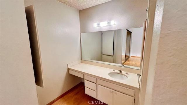 445 W Duarte Rd Unit 5, Arcadia, CA 91007 - bathroom with vanity, a textured ceiling, and wood finished floors