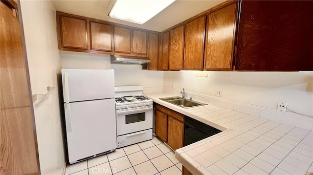 445 W Duarte Rd Unit 5, Arcadia, CA 91007 - kitchen with white appliances, under cabinet range hood, tile counters, brown cabinets, and light tile patterned flooring