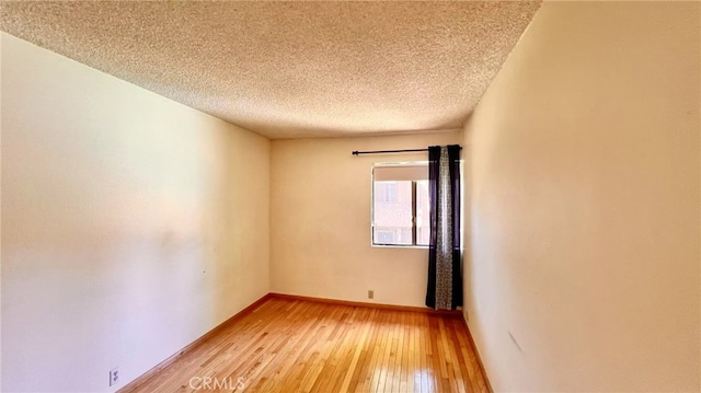445 W Duarte Rd Unit 5, Arcadia, CA 91007 - empty room featuring light wood-style flooring and a textured ceiling