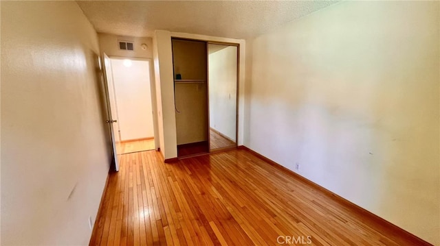 445 W Duarte Rd Unit 5, Arcadia, CA 91007 - unfurnished bedroom with light wood-style flooring and a closet
