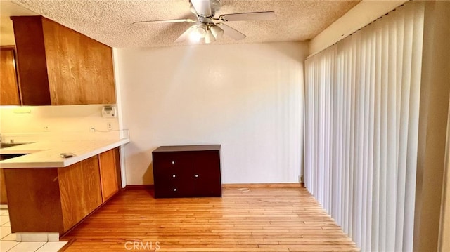 445 W Duarte Rd Unit 5, Arcadia, CA 91007 - unfurnished dining area featuring a ceiling fan, a textured ceiling, and light wood-style flooring
