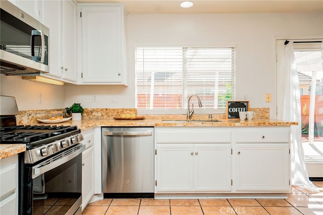 382 Settlers Rd, Upland, CA 91786 - kitchen with appliances with stainless steel finishes, a sink, plenty of natural light, and light tile patterned flooring