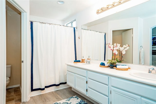 382 Settlers Rd, Upland, CA 91786 - full bathroom featuring toilet, double vanity, wood finished floors, and shower / bath combo