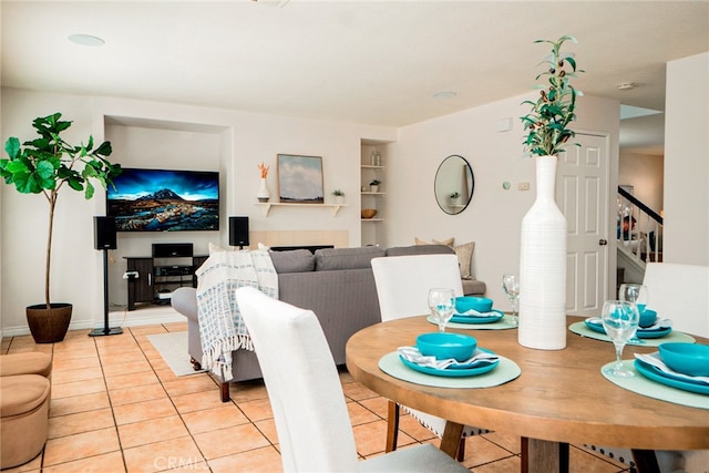 382 Settlers Rd, Upland, CA 91786 - dining space with light tile patterned flooring, stairs, and built in shelves