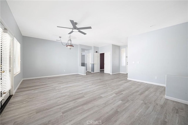 31460 Tulette Ln, Winchester, CA 92596 - unfurnished living room with ceiling fan, light wood-type flooring, and baseboards