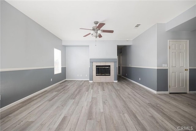 31460 Tulette Ln, Winchester, CA 92596 - unfurnished living room featuring a ceiling fan, wood finished floors, a fireplace, and baseboards