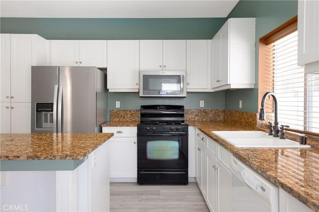 31460 Tulette Ln, Winchester, CA 92596 - kitchen with stainless steel appliances, a sink, white cabinets, and plenty of natural light