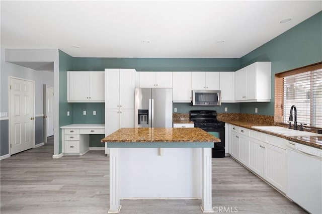 31460 Tulette Ln, Winchester, CA 92596 - kitchen with appliances with stainless steel finishes, a sink, light wood-type flooring, white cabinets, and recessed lighting