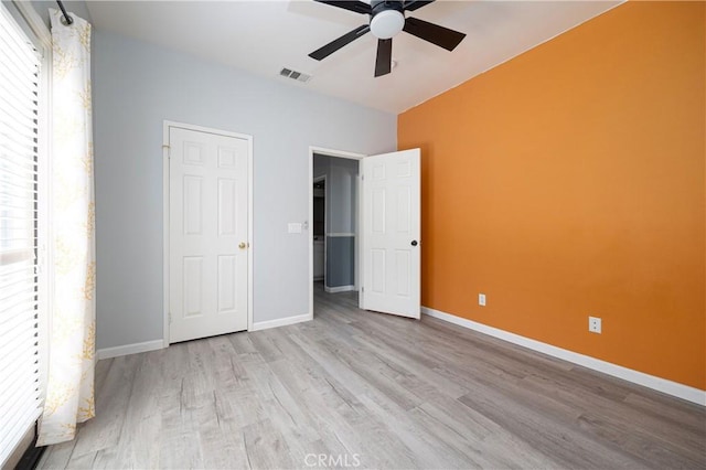 31460 Tulette Ln, Winchester, CA 92596 - unfurnished bedroom with wood finished floors, baseboards, and a ceiling fan