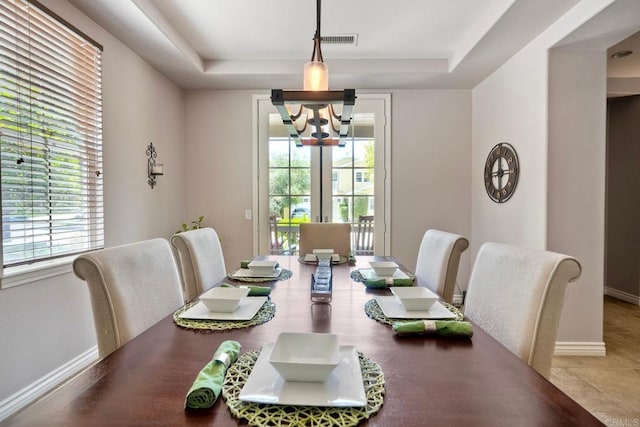 3522 Camino Cereza, Carlsbad, CA 92009 - dining room with a chandelier, a tray ceiling, and baseboards