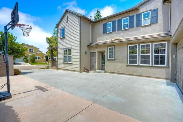 3522 Camino Cereza, Carlsbad, CA 92009 - rear view of property with stucco siding and a patio
