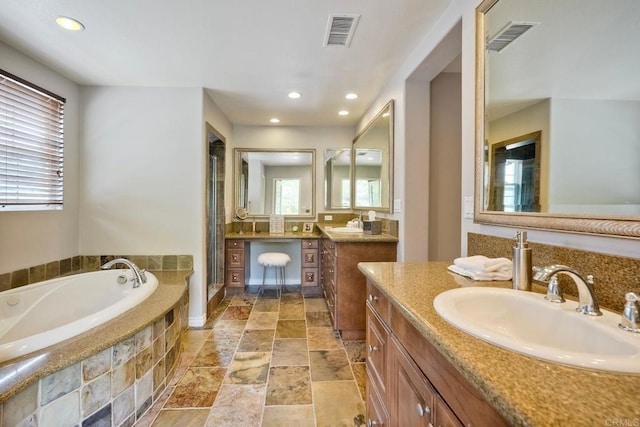 3522 Camino Cereza, Carlsbad, CA 92009 - full bathroom with a bath, two vanities, a stall shower, recessed lighting, and stone tile flooring