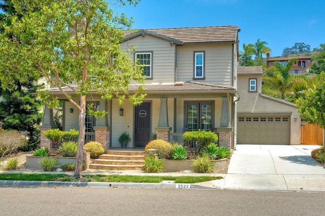 3522 Camino Cereza, Carlsbad, CA 92009 - view of front of home featuring brick siding, concrete driveway, and a porch