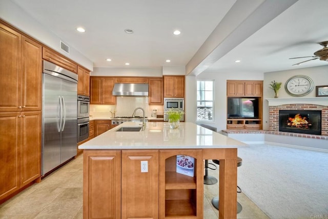 3522 Camino Cereza, Carlsbad, CA 92009 - kitchen with built in appliances, a sink, extractor fan, a ceiling fan, and light countertops