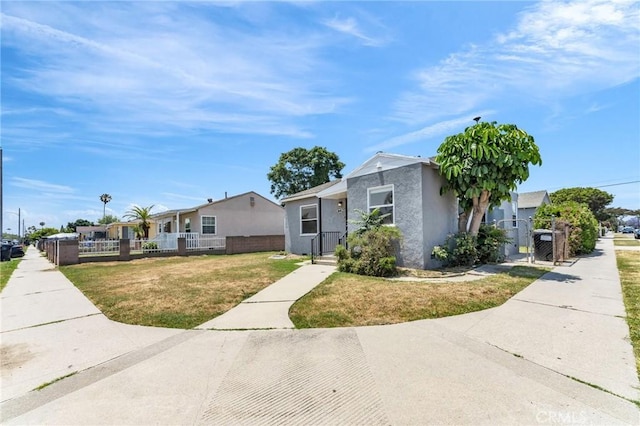 14403 S White Ave, Compton, CA 90221 - view of front facade featuring a gate and stucco siding