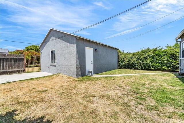 14403 S White Ave, Compton, CA 90221 - back of house with stucco siding and an outdoor structure